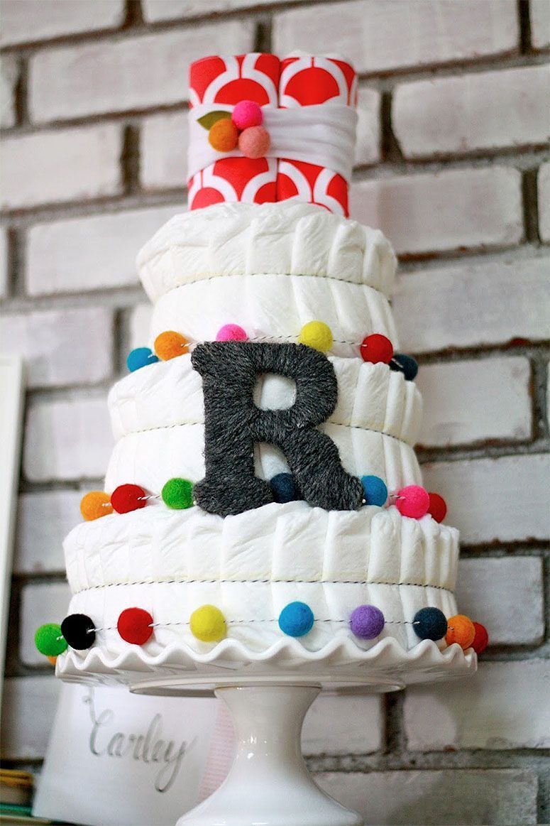 Foto: Reprodução / <a href="http://domesticcharm.blogspot.com.br/2013/06/diaper-cake-tutorial.html" target="_blank">Domestic Charm</a>